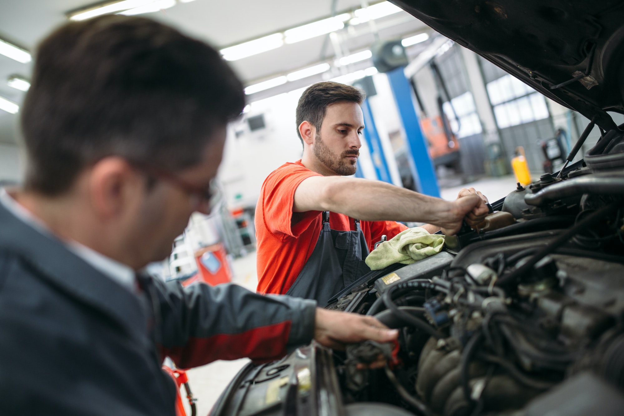 profecional-car-mechanic-changing-motor-oil-at-maintenance-repair-service-station.jpg